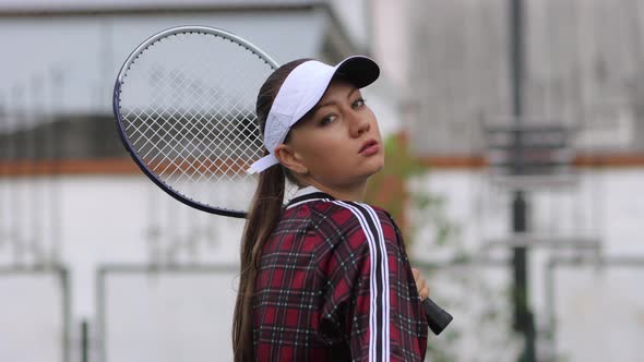 Attractive Woman Playing Tennis on Court