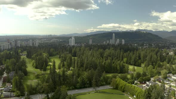 Aerial shot of golf course and Tri-Cities on background in Vancouver, British Columbia, Canada, Coqu alt