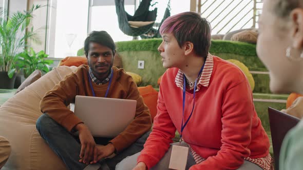 Slowmo Shot of Start-Up Workers Discussing Project alt