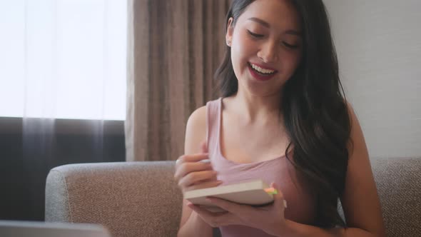 attractive smart asian female freelance career work from home video conference alt