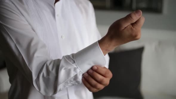 Closeup View of Young Male Hands Getting Dressed at Morning Wedding alt