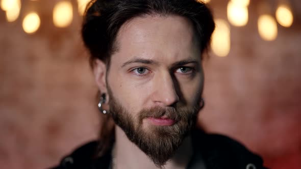 Portrait of Charismatic Handsome Man Looking at Camera Attractive Male Face alt