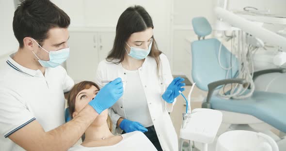 Dentist and Assistant Working