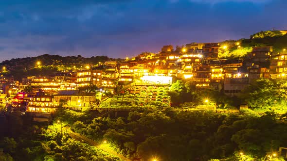 day to night time lapse of Jiufen village with mountain in raining day, Taiwan