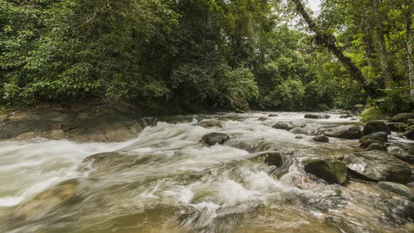 Timelapse water flow over rock at Sungai Sedim alt