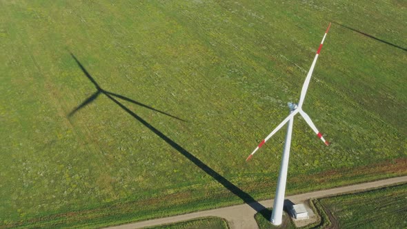 Aerial View of Windmills and Shadows in Rotation alt