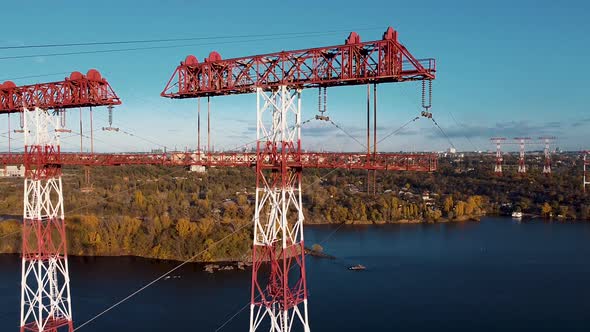 huge high voltage post.High voltage tower under river. power line tower alt