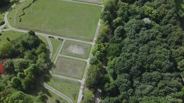 Walking paths and sports grounds in the park area. Aerial photography. alt