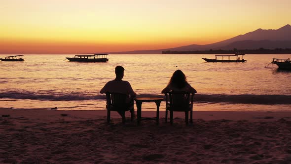 Happy man and woman after marriage in love have fun on beach on clean white sand 4K background alt