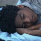 Homeless Afro-American teen boy sleeping on street - VideoHive Item for Sale