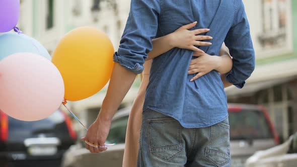 Guy with Balloons Waiting for Date, Girl Approaching and Hugging Him, Meeting alt