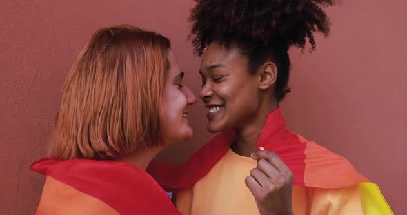 Young lesbian couple having tender moment together - LGBT pride concept alt
