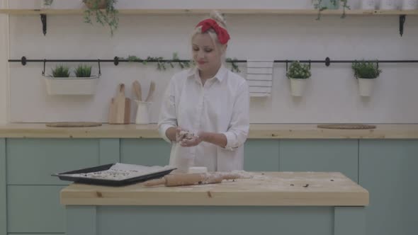 Trendy Woman Preparing Pastry on Kitchen Table