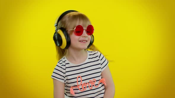 Funny Playful Blonde Kid Child Girl Listening Music Via Headphones Dancing Disco Fooling Having Fun alt