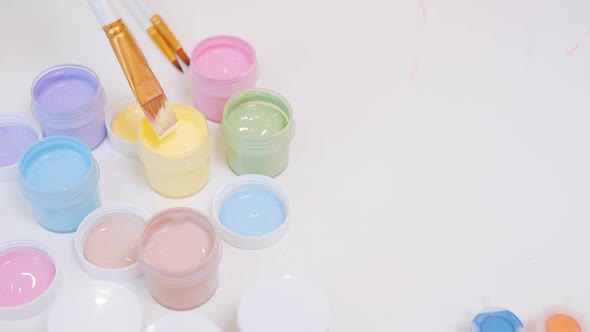 Dipping the Brush in Yellow Paint alt