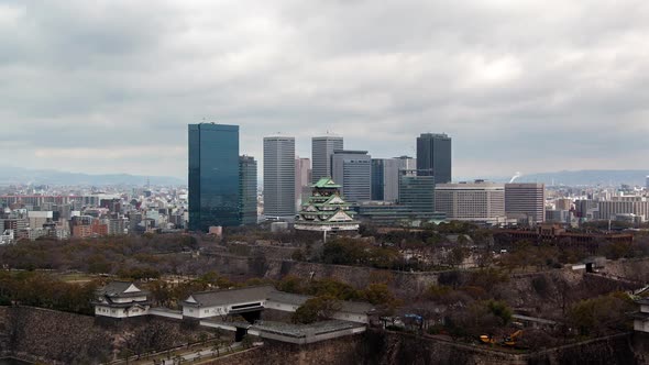 Osaka Ancient Castle Against Skyscrapers Timelapse alt
