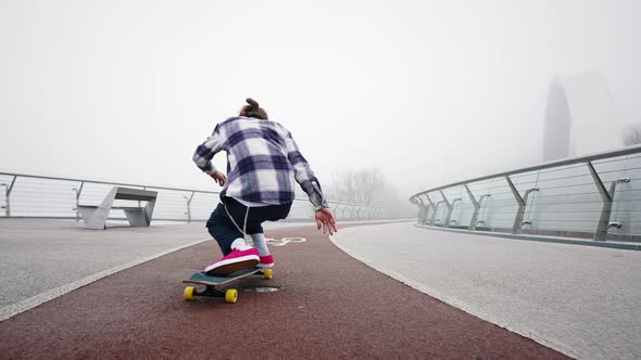 Rear View of a Professional Skater Demonstrating Different Riding Styles alt