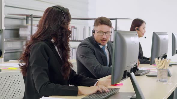 Business People Wearing Headset Working in Office alt