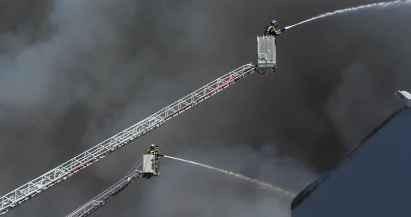 A factory burning, Aigues Mortes, Occitanie, France alt
