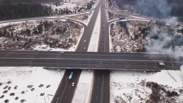 Country Highway with Roundabout and Automobile Bridge in Winter Aerial View alt