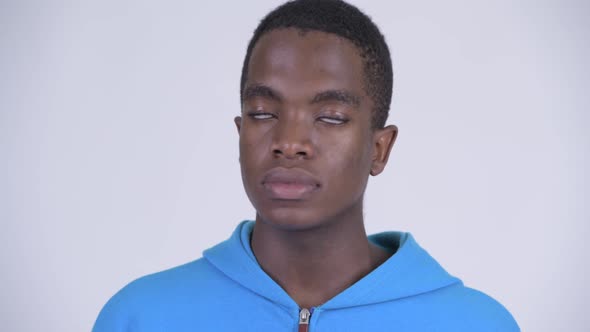 Face of Young Stressed African Man Looking Tired and Bored alt
