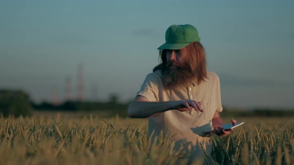 Grown Hipster Farmer Checks Crops Harvest alt
