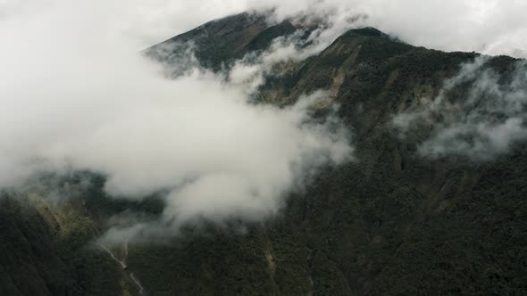 Active Tungurahua Volcano Covered In Dense Cloudscape Within The Bounds Of Baños, Ecuador- Cordiller alt