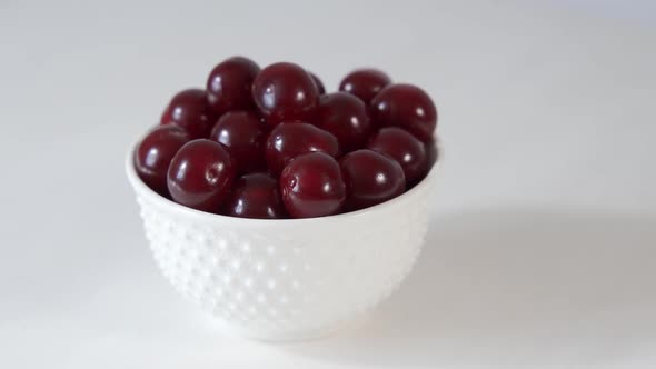 Bowl of Red Cherries on Table