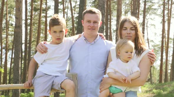 Family Caucasian Children Portrait Laughting with Parents on Park alt