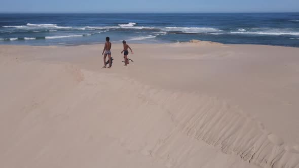 Kids Seen Walking Along Sand Dunes