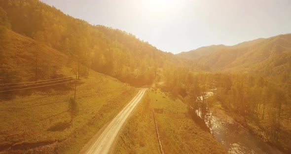 Low Altitude Flight Over Fresh Fast Mountain River with Rocks at Sunny Summer Morning. alt