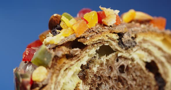 Easter cake is decorated with icing, candied fruit, nuts and chocolate alt