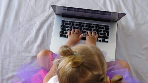 Child uses laptop