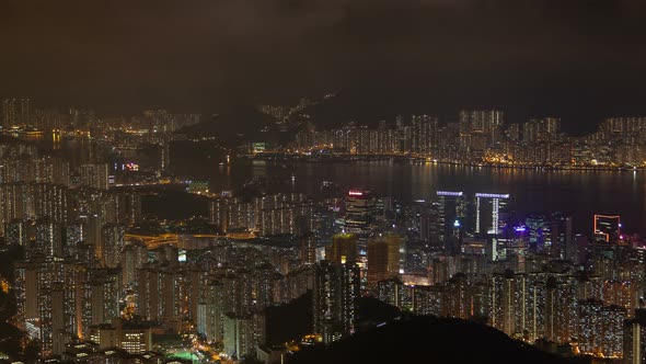Hong Kong Urban Cityscape Aerial Skyline Panorama Timelapse at Night Pan Up alt