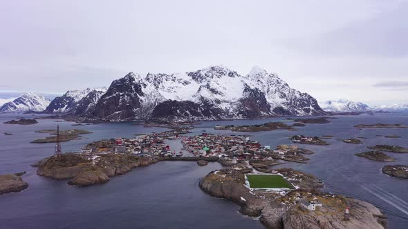 Henningsvaer Village and Mountains in Winter. Lofoten, Norway. Aerial View alt