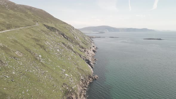 Narrow Road On Cliff Of Achill Island With Scenic View Of Atlantic Ocean In Ireland. - aerial alt