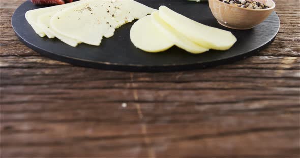 Sliced cheese with herbs and spices alt