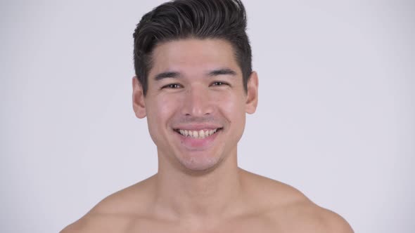 Face of Happy Young Handsome Muscular Shirtless Man Smiling alt