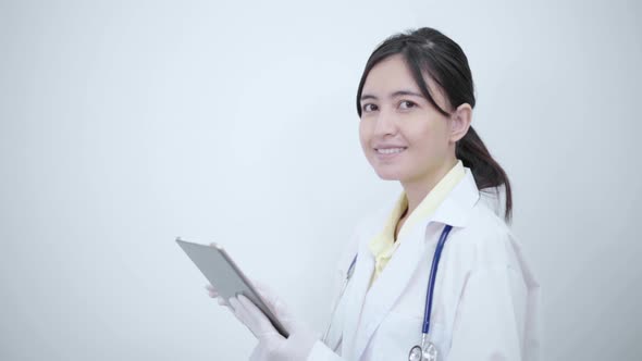 Female doctor  touch tablet screen searching report or disease information.