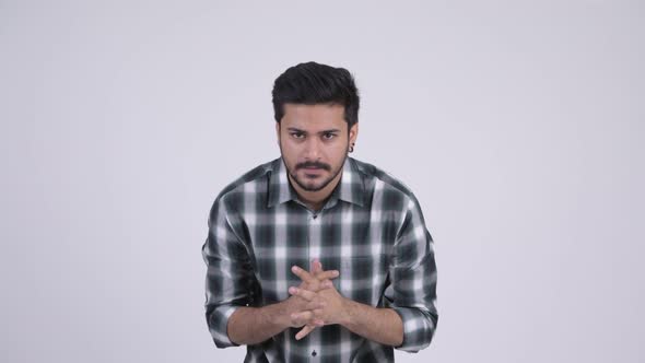 Portrait of Young Happy Bearded Indian Man Getting Good News alt