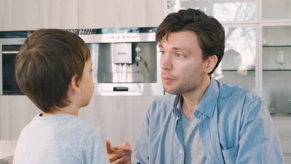 Father Scolds His Son for Bad Behavior alt