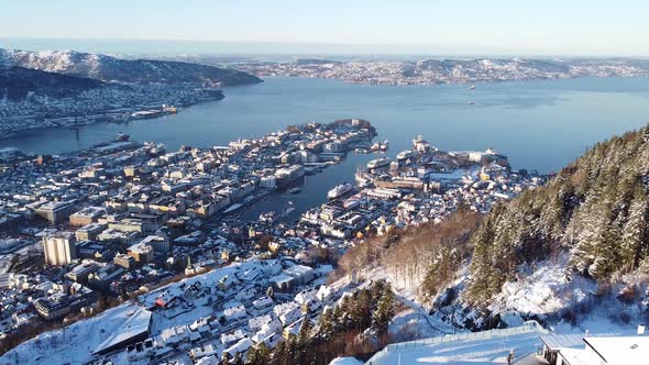 Aerial backwards through mount Floyen with Bergen city view as Background alt