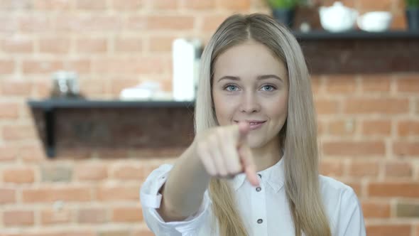 Woman Pointing toward Camera, Indoor alt