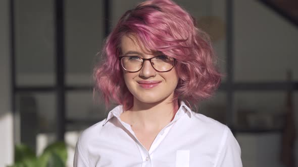 Smiling Young Hipster Teen Girl Pink Hair Wear Glasses Posing Indoors Portrait alt