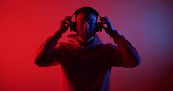 Young Man Listening To Music with Headphones alt