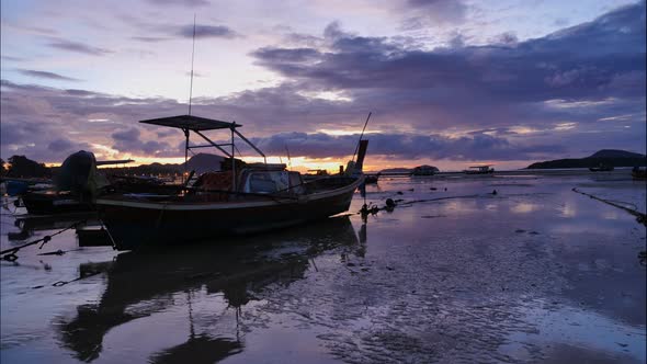 Time Lapse Colorful Sunrise Above Fishing Boat. alt