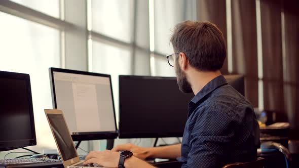 Salesman Analyzing Charts.Businessman On Workplace Office Work.Man Working In Office On Laptop alt
