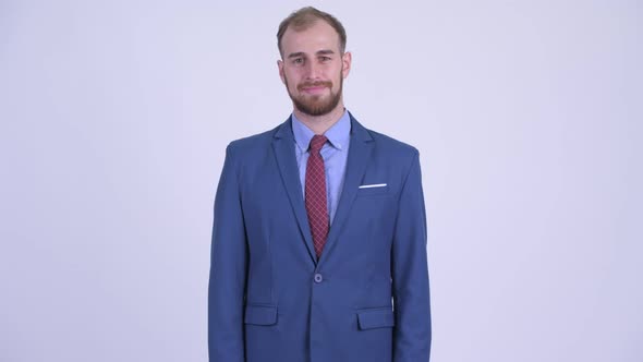 Happy Bearded Businessman in Suit Smiling