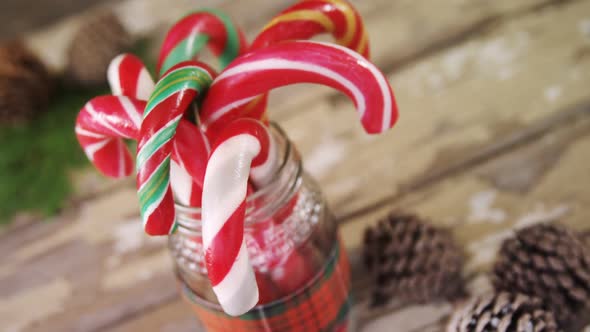 Candy canes arranged in a jar alt