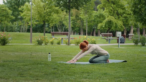 Young woman doing stretch exercises. alt
